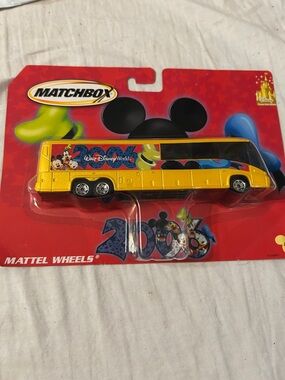Matchbox Yellow Disney World Tour Bus with Character Graphics